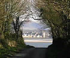 caernarfon castle from the isle of anglesey coastal path